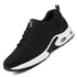 Black mesh athletic sneaker with white sole and air cushioning, lace-up, modern streetwear style.