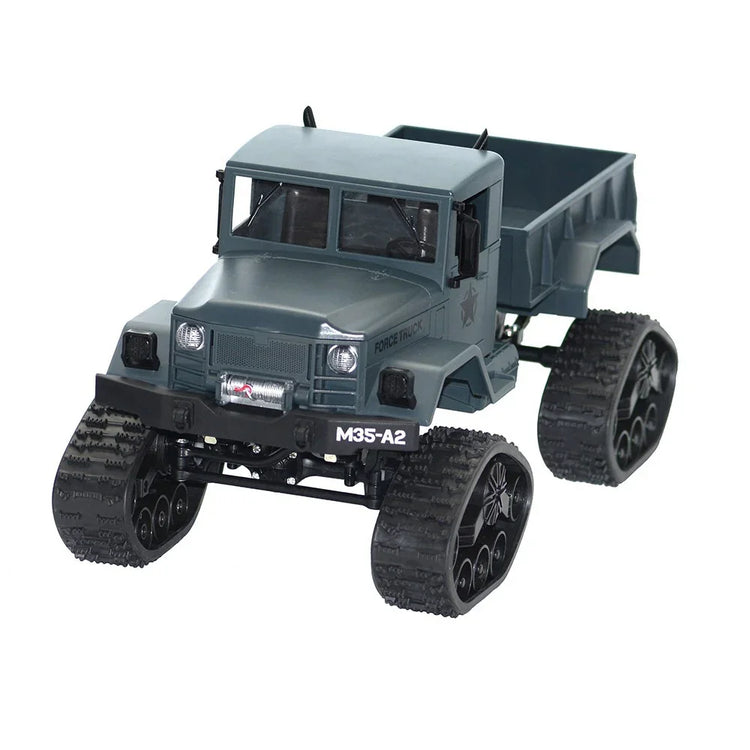 Gray military-style toy truck with rugged treads and a boxy design on white background