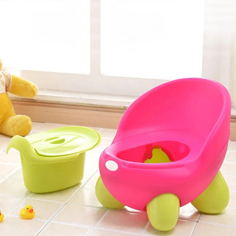 Pink and green plastic potty chair with removable inner bowl for toddlers