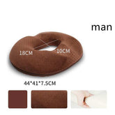 Brown memory foam seat cushion with donut shape, soft textured material, ergonomic design
