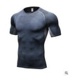 Dark gray compression shirt with geometric pattern, short sleeves, and fitted athletic cut for active wear.