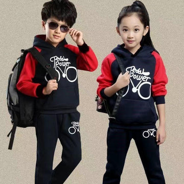 Kids wearing navy blue and red casual hoodie tracksuits with graphic text, relaxed fit.