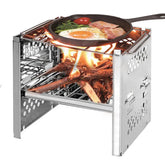 Portable stainless steel wood burning camping stove with grilled breakfast in a skillet