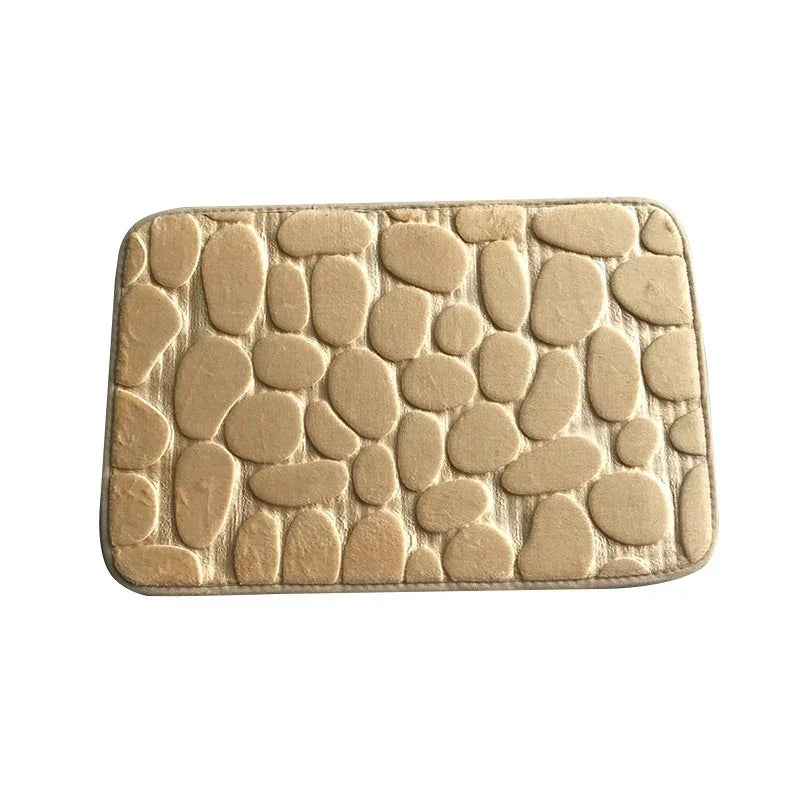 Rectangular beige floor mat with soft pebble pattern and plush texture