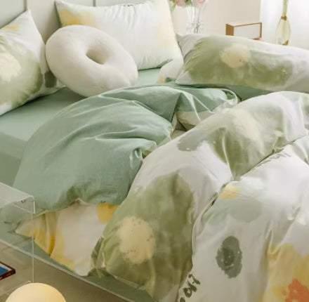 Soft pastel floral bedding set with green duvet cover, cotton material, relaxed fit.