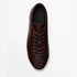 Brown leather low-top sneaker with white sole, minimalist design, classic fit