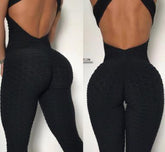 Black textured high-waisted leggings with honeycomb pattern, body-hugging fit, open back style