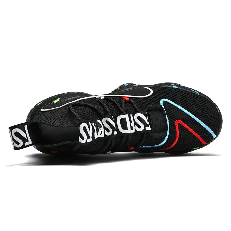 Black mesh sneaker with colorful accents, chunky sole, and bold white text strap, modern fit