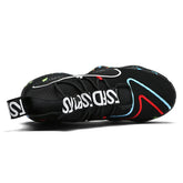 Black mesh sneaker with colorful accents, chunky sole, and bold white text strap, modern fit