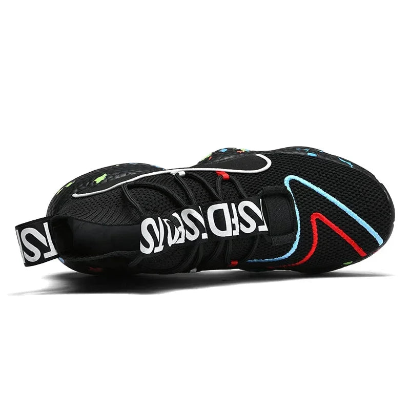 Black mesh sneaker with colorful accents, chunky sole, and bold white text strap, modern fit