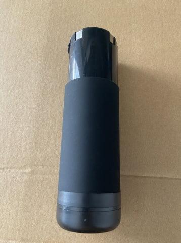 Matte black insulated tumbler with sleek cylindrical design on a brown background