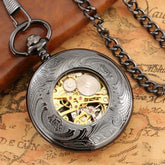 Vintage silver pocket watch with exposed gold gears, ornate engraved metal, and chain accessory