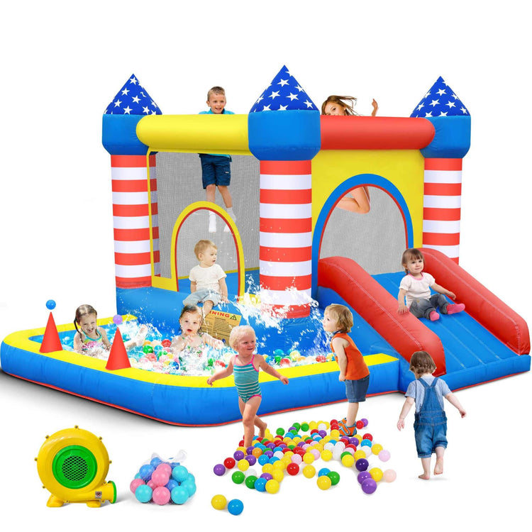 Children playing in a colorful inflatable bounce house with ball pit and slide