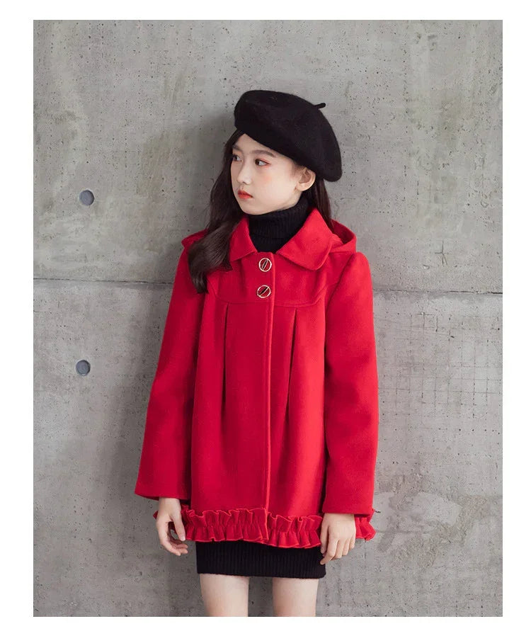Girl wearing a red wool coat with ruffled hem, black knit dress, and black beret, modern fit