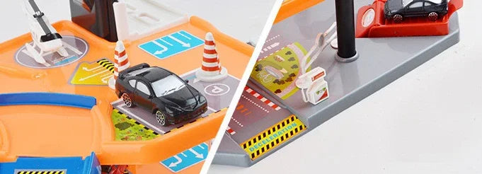 Toy car parking garage playset with miniature black cars, orange ramps, and road cones