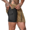Black compression shorts with side pocket under tan cargo shorts, fitted athletic wear for streetwear style