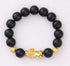 Black beaded bracelet with gold accents and lion charm, modern streetwear accessory