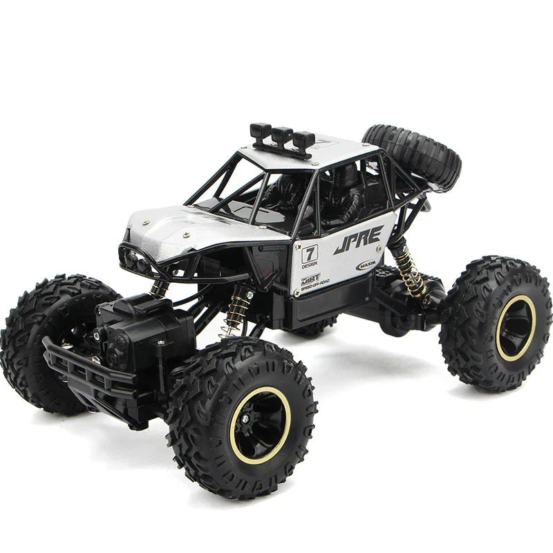 Black and silver remote control off-road truck with rugged tires and detailed suspension
