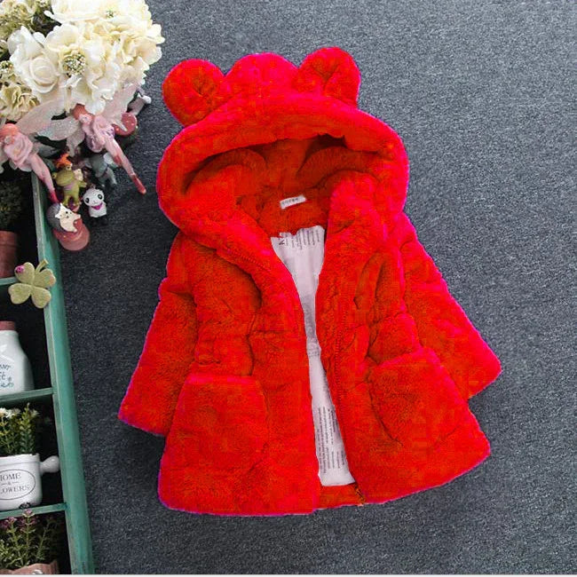 Bright red faux fur hooded jacket with bear ears, plush material, relaxed fit, two pockets.