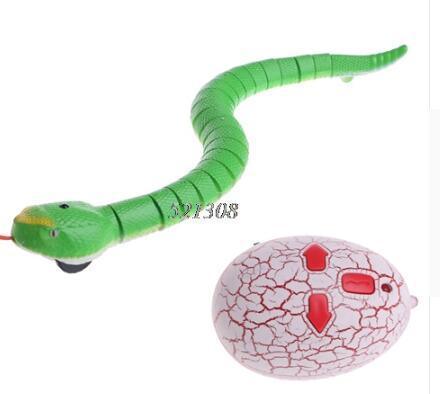 Green segmented rubber snake toy with remote control, realistic reptile design.