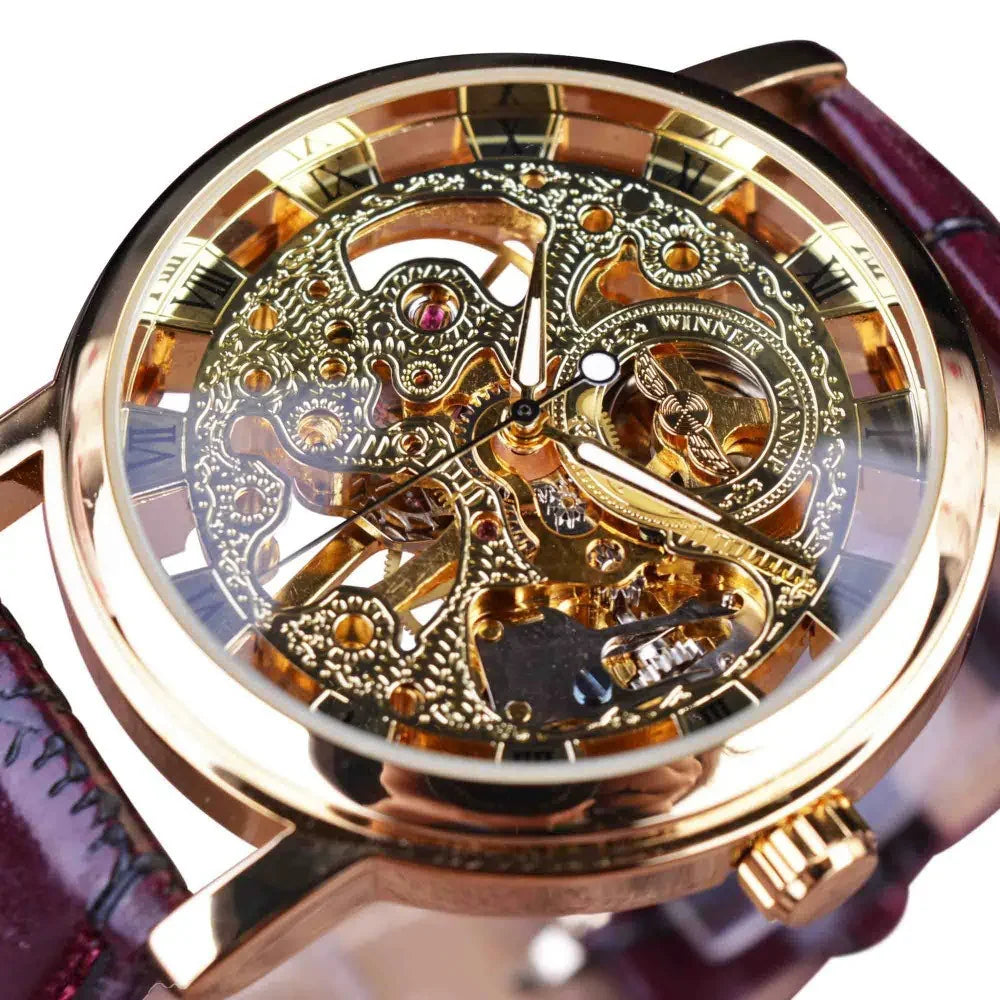 Gold skeleton mechanical watch with intricate gears, roman numerals, and brown leather strap