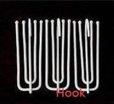 Set of silver metal S-shaped hooks against a black background, minimalist style