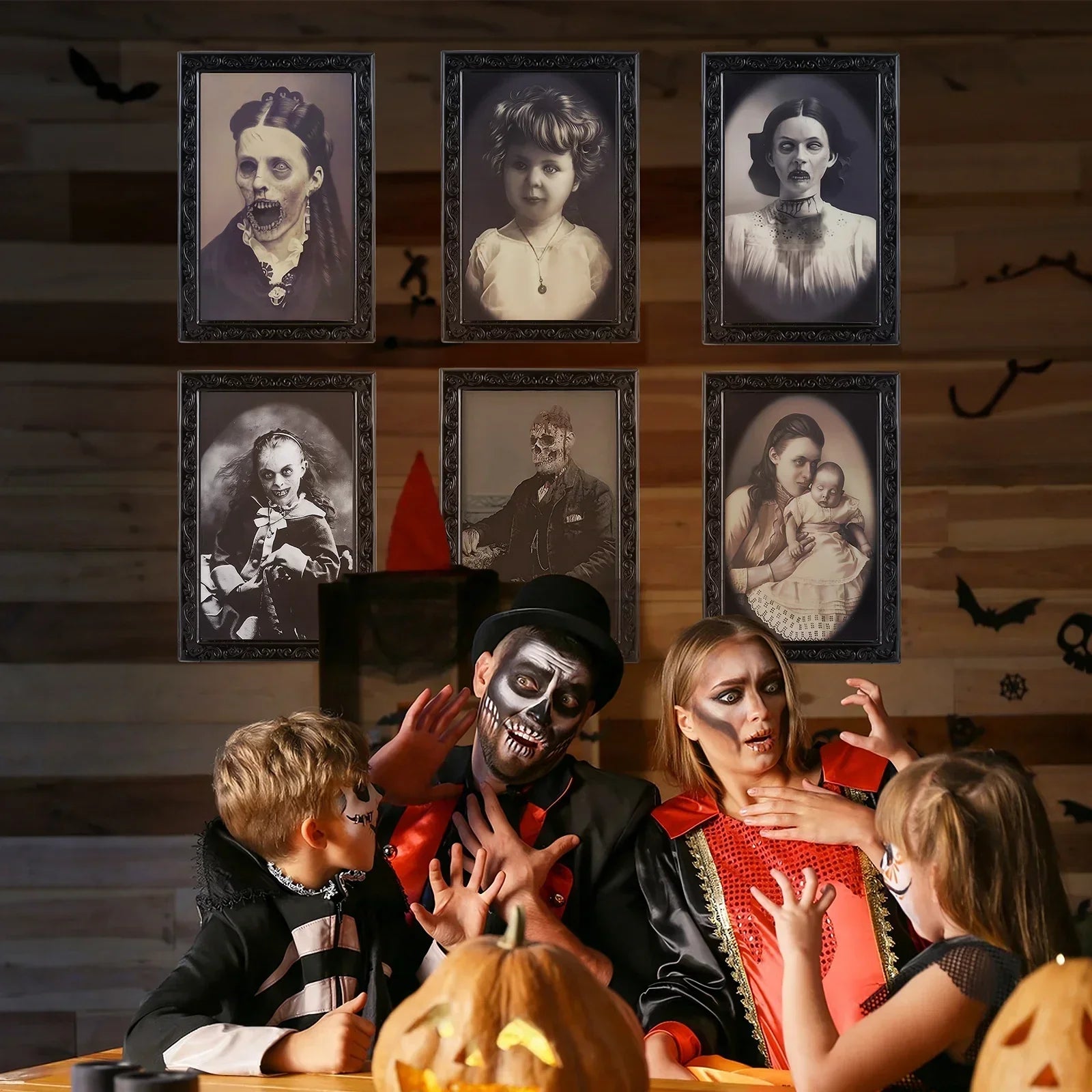 Family in Halloween skeleton costumes and makeup with black, red, and gold accents, gathered indoors