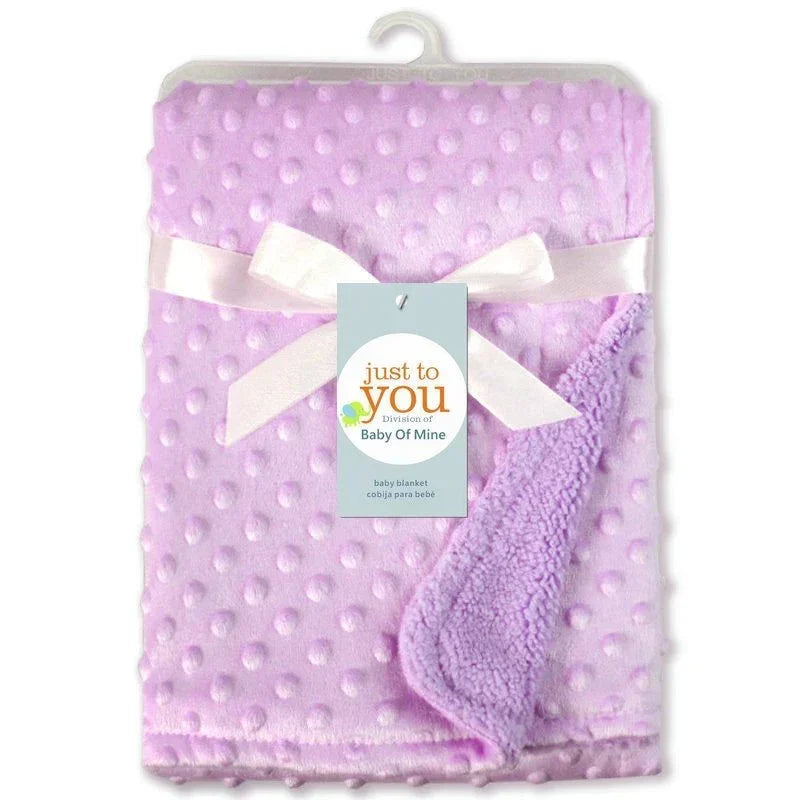 Soft lavender baby blanket with raised dots, plush texture, ribbon tie, cozy fit
