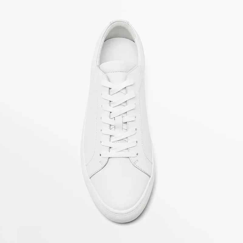 Minimalist white leather sneaker with lace-up design and low-top fit on white background
