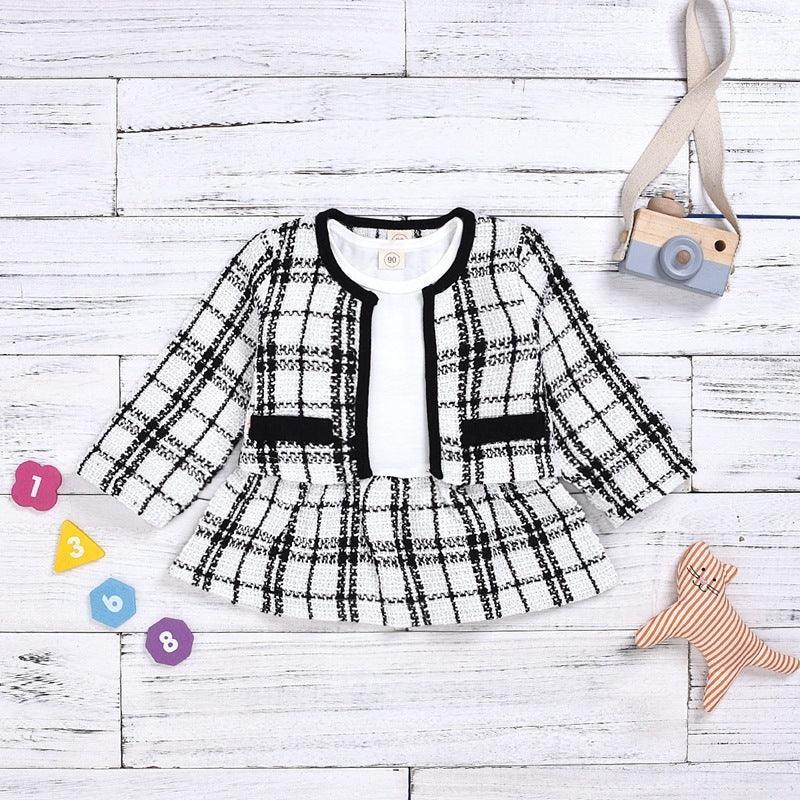 Kids' black and white plaid tweed jacket and skirt set with long sleeves, soft material, classic fit.
