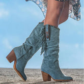 Blue suede knee-high boots with fringe, block heel, and decorative studs, relaxed fit