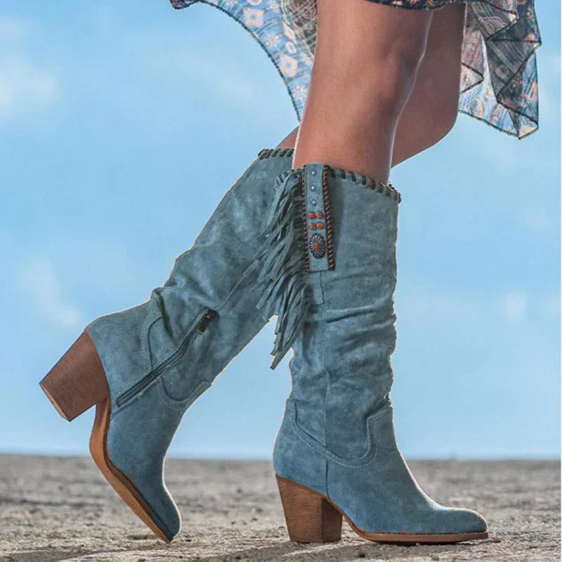Blue suede knee-high boots with fringe, block heel, and decorative studs, relaxed fit