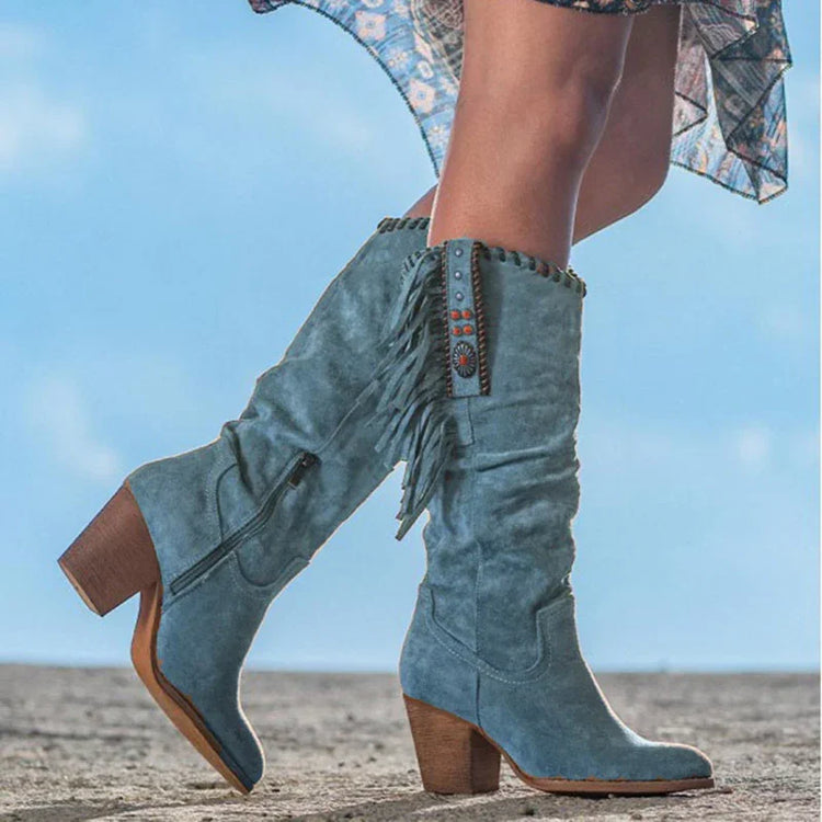 Blue suede knee-high boots with fringe, block heel, and decorative studs, relaxed fit