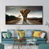 Modern living room with teal sofa, colorful throw pillows, wall art of an elephant on a road