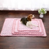 Pink quilted pet mat with beagle resting on layered sizes, soft cushioned design for comfort