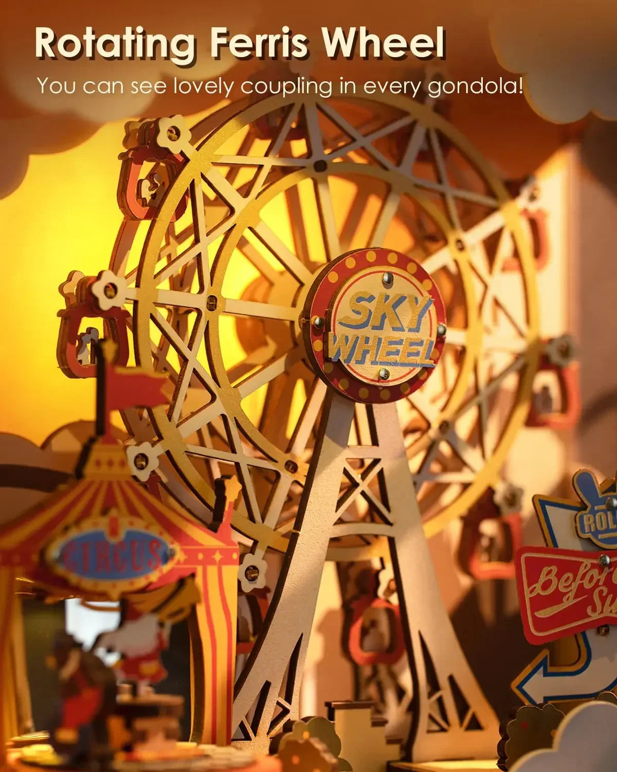 Close-up of a miniature rotating Ferris wheel with gold and red details, carnival setting