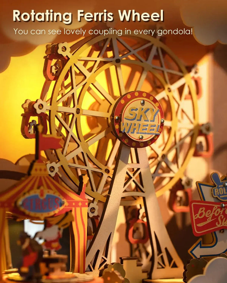 Close-up of a miniature rotating Ferris wheel with gold and red details, carnival setting