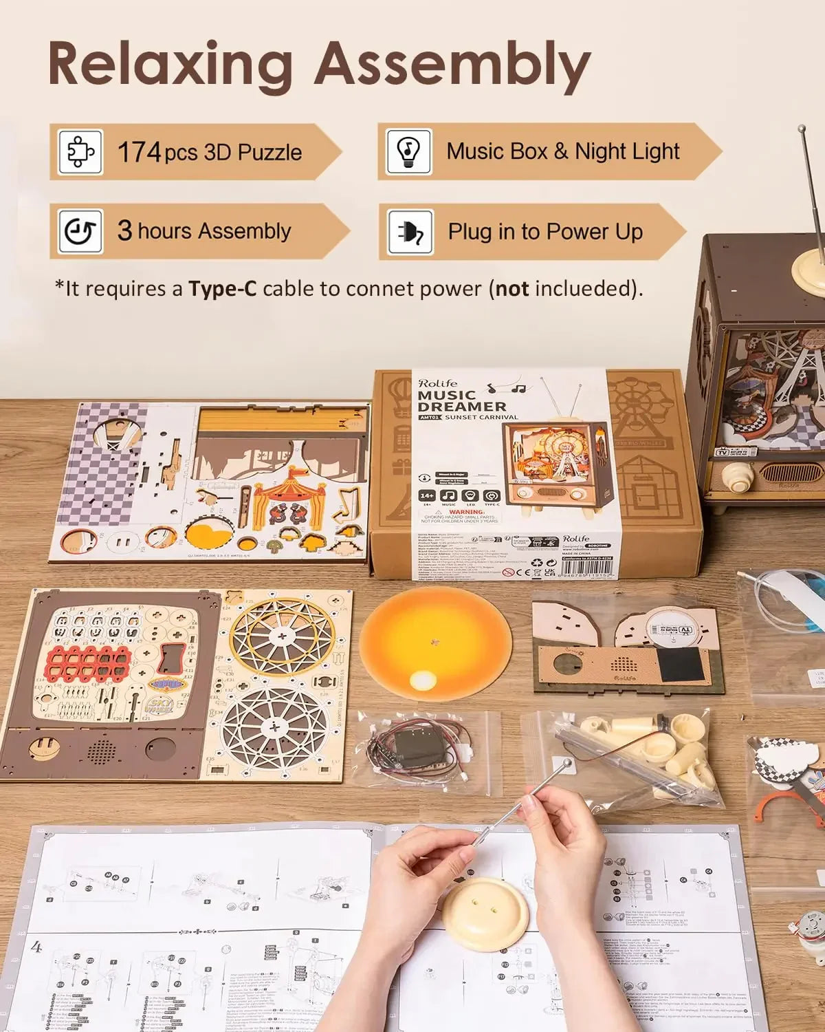 Person assembling a wooden 3D puzzle music box kit with organized parts and instructions on table.