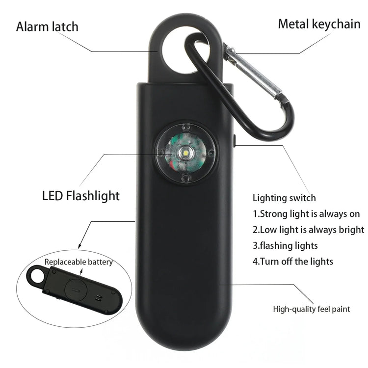 Black personal safety alarm with LED flashlight, metal keychain, and replaceable battery.