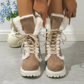 Beige suede lace-up winter boots with white faux fur lining and chunky soles