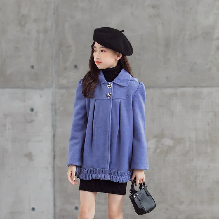 Girl in a loose-fitting light purple wool coat with button details and black beret