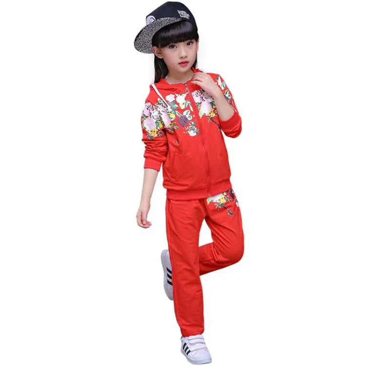 Girl wearing red floral graphic tracksuit with hooded jacket and relaxed fit pants