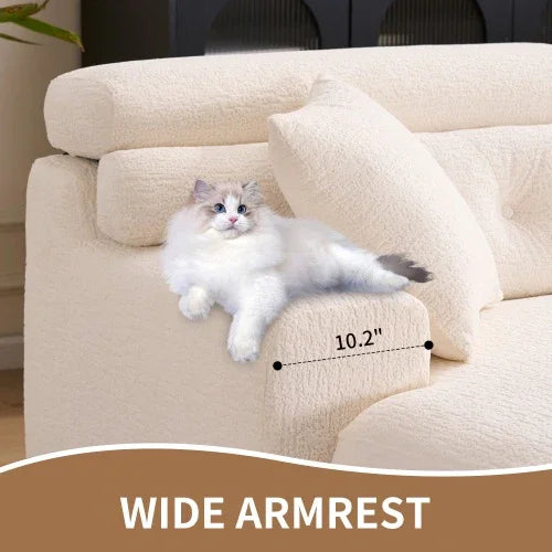 Cream textured fabric sofa with wide armrest, relaxed fit, featuring a lounging cat