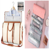 Cream and brown canvas duffel bag with garment section, pink and gray hanging toiletry organizer