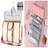 Cream and brown canvas duffel bag with garment section, pink and gray hanging toiletry organizer