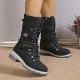 Black lace-up winter boots with knit cuffs and thick rubber soles, rugged streetwear style.