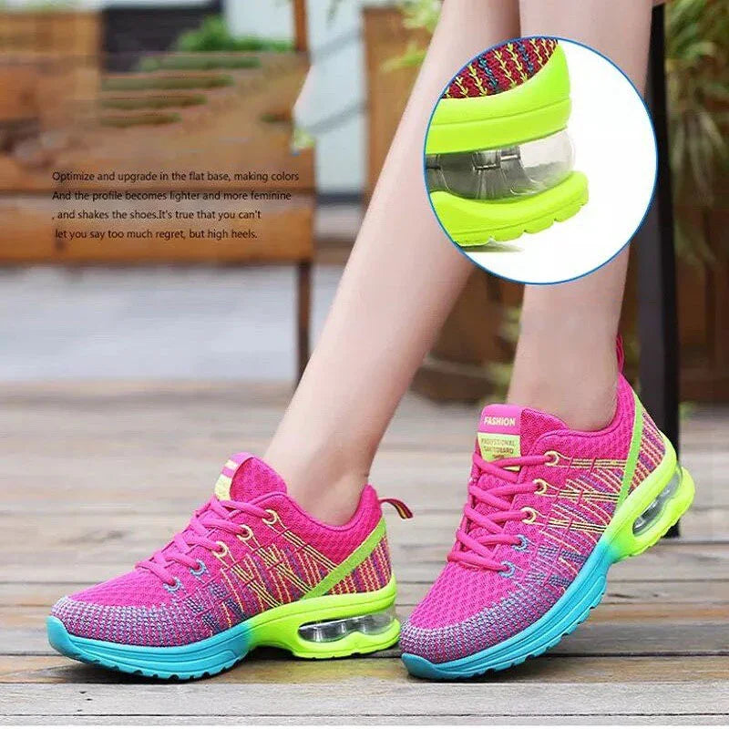Women’s bright pink and neon green mesh running sneakers with cushioned air soles, athletic fit