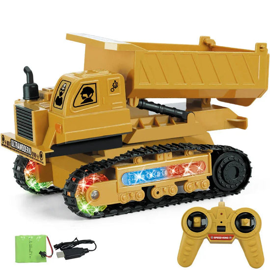 Yellow remote control dump truck toy with black treads, LED lights, and included controller
