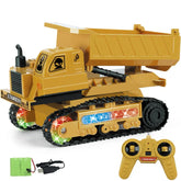Yellow toy dump truck with black tracks, LED lights, and remote control set