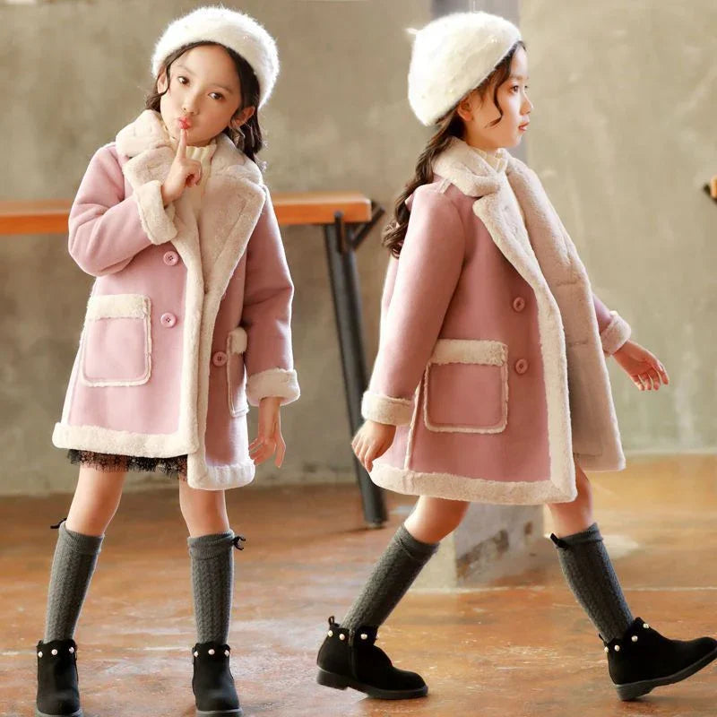 Girl in a pink faux fur coat with white trim, knit hat, knee socks, and black boots